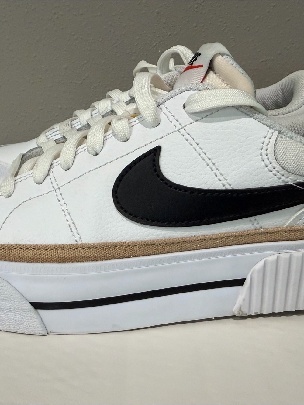 Nike Women’s White Sneakers with Black Swoosh and Tan Trim